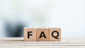 FAQ sign on an office table